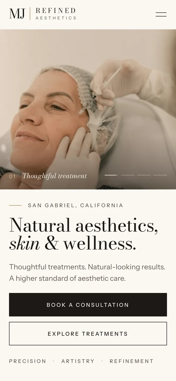 MJ Refined Aesthetics homepage on a phone